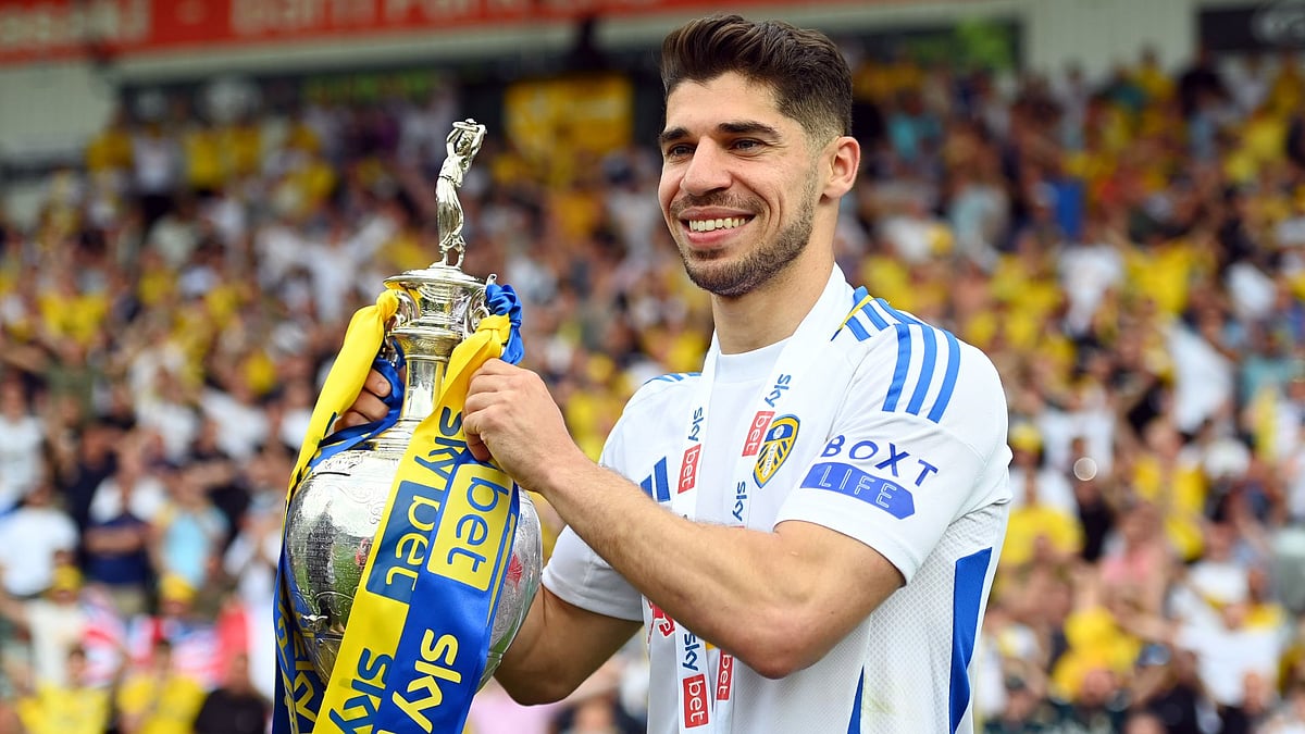 Solomon holds the Championship trophy