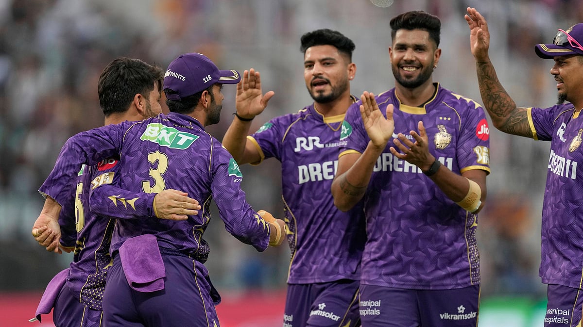Kolkata Knight Riders captain Ajinkya Rahane, left, celebrates with teammates. AP