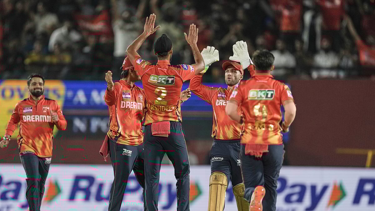AP Photo/Ashwini Bhatia : Punjab Kings' Arshdeep Singh celebrates the dismissal of Lucknow Super Giants' Aiden Markram with teammates during the Indian Premier League cricket match in Dharamshala.