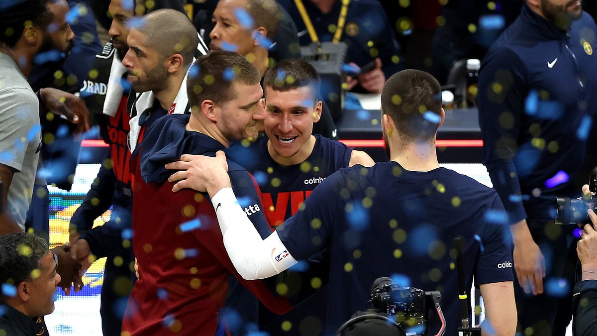 Nikola Jokic #15 of the Denver Nuggets celebrates with teammates after defeating the LA Clippers 120-101 in Game Seven of the Western Conference First Round NBA Playoffs at Ball Arena on May 03, 2025 in Denver, Colorado.