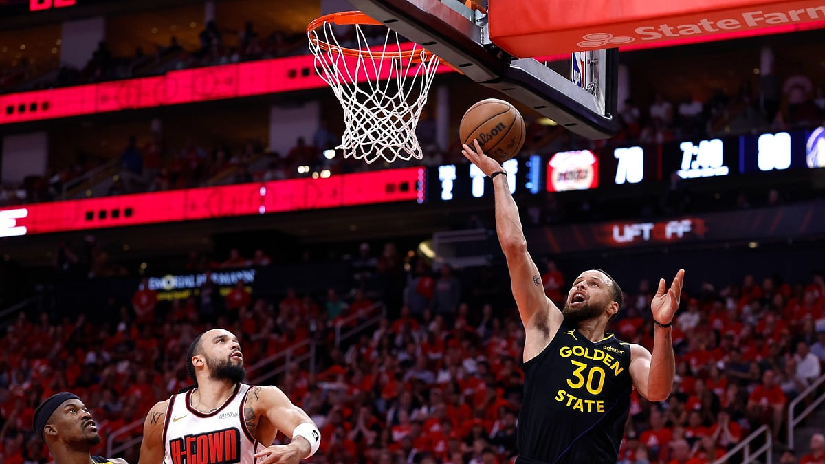 Stephen Curry attempts a shot in the Golden State Warriors' Game 7 win over the Houston Rockets in the 2025 NBA Playoffs.