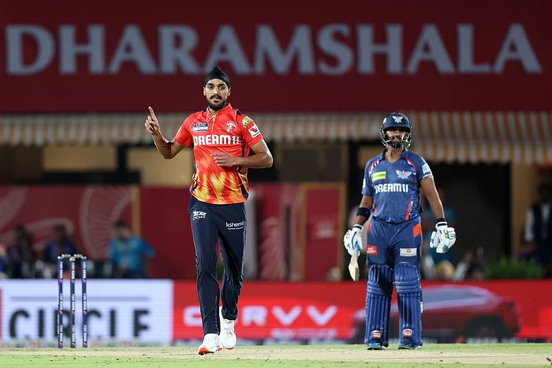 Arshdeep Singh celebrates after taking the wicket of Nicholas Pooran