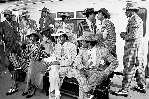 | Photo: Getty Images : View of members of the American R&B, Disco, & Funk group Kool & the Gang during a video shoot (for their song 'Hi de Ho, Hi de Hi') on the platform at the Roosevelt Avenue and Main Street subway station in Queens, New York, New York,
