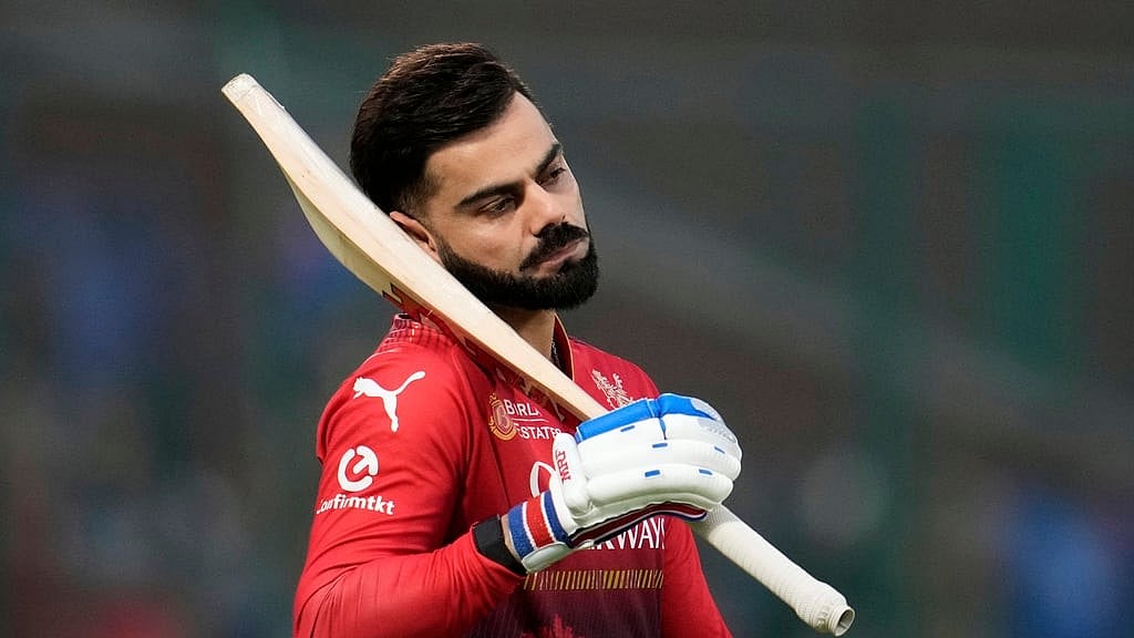 AP/Manish Swarup : Royal Challengers Bengaluru's Virat Kohli warms up.