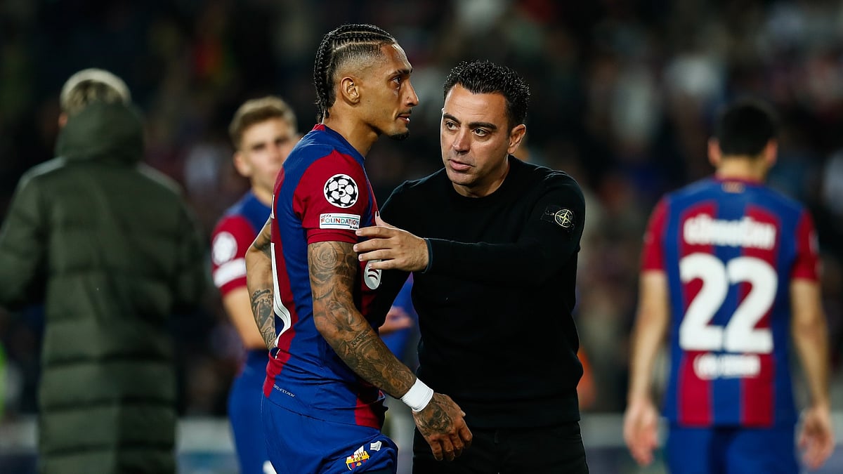 Raphinha and former Barcelona boss Xavi