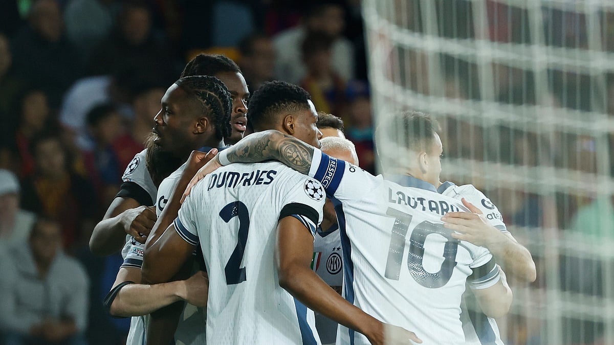 Inter Milan's Marcus Thuram, left, celebrates with his teammates after scoring his side's opening goal during the Champions League semifinal first leg football match in Barcelona. - AP Photo/Joan Monfort
