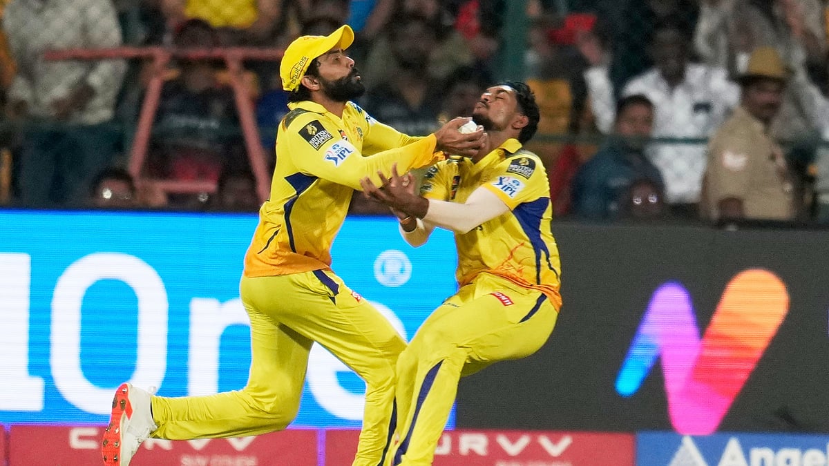 AP Photo/Aijaz Rahi : Chennai Super Kings' Ravindra Jadeja, left, and teammate Matheesha Pathirana collide as they run to catch the ball during the Indian Premier League cricket match in Bengaluru.