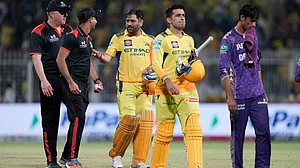 | Photo: AP Photo/Bikas Das : Chennai Super Kings' captain Mahendra Singh Dhoni and batting partner Anshul Kamboj leave the field at the end of the IPL 2025 match against Kolkata Knight Riders.