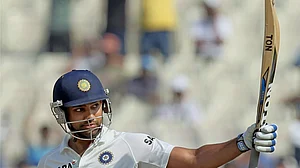 PTI : In this 2013 file photo, Rohit Sharma celebrates after completing 150 runs on the third day of a Test match against West Indies, at the Eden Gardens.