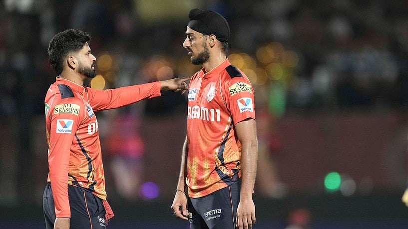 AP/Ashwini Bhatia : Punjab Kings captain Shreyas Iyer with his team's lead pacer Arshdeep Singh.