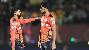 AP/Ashwini Bhatia : Punjab Kings captain Shreyas Iyer with his team's lead pacer Arshdeep Singh.