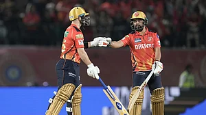 AP Photo/Ashwini Bhatia : Punjab Kings' Josh Inglis, left, and Punjab Kings' Prabhsimran Singh bump fists during the Indian Premier League cricket match in Dharamshala.