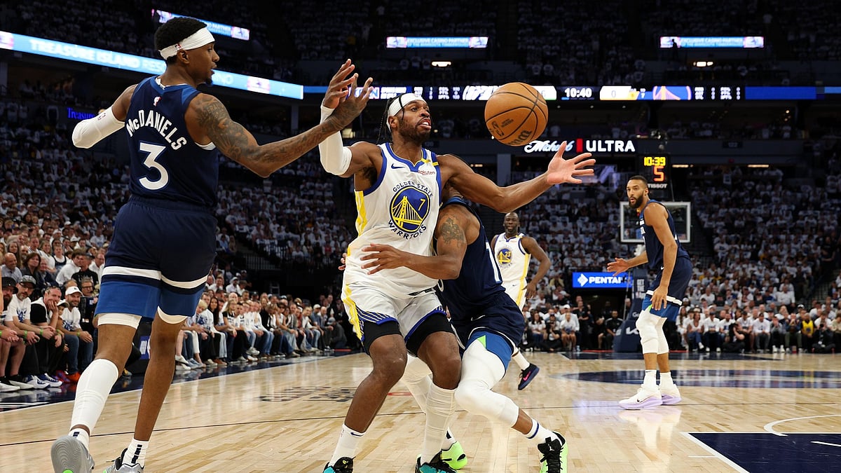 Jaden McDaniels #3 of the Minnesota Timberwolves knocks the ball loose against Buddy Hield #7 of the Golden State Warriors in the first quarter of Game Two of the Western Conference Second Round NBA Playoffs at Target Center on May 08, 2025 in Minneapolis, Minnesota.