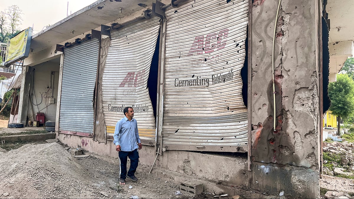 Poonch: A civilian looks at damaged properties after heavy firing and shelling by Pakistan military overnight across the Line of Control and International Border, at Mendhar area of Poonch district, Jammu and Kashmir, Wednesday, May 7, 2025.  - PTI