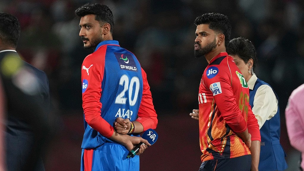 AP/Ashwini Bhatia : Delhi Capitals' captain Axar Patel, left, and Punjab Kings' captain Shreyas Iyer wait for the toss