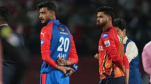 AP/Ashwini Bhatia : Delhi Capitals' captain Axar Patel, left, and Punjab Kings' captain Shreyas Iyer wait for the toss