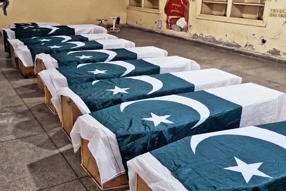 | Photo: AP : Payback Time: Caskets wrapped in Pakistani flags are placed for funeral services in Bahawalpur, Pakistan’s Punjab province, on 
May 7, 2025