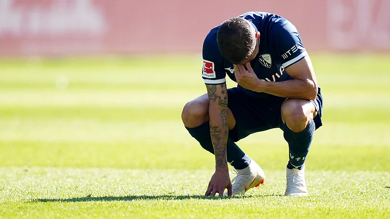 Cristian Gamboa looks distraught following Bochum's relegation - null