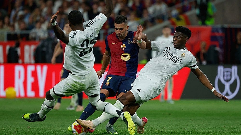 | Photo: AP/Joan Monfort : The upcoming match between FC Barcelona and Real Madrid will be live-streamed on the FanCode platform.