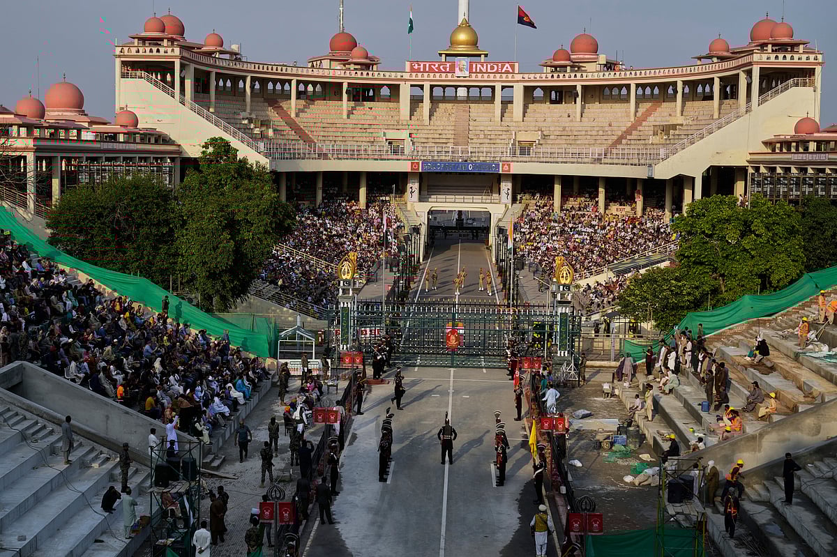 AP : Pakistan's Rangers soldiers, bottom, and Indian Border Security Forces soldiers, top, at the Wagah border, Punjab