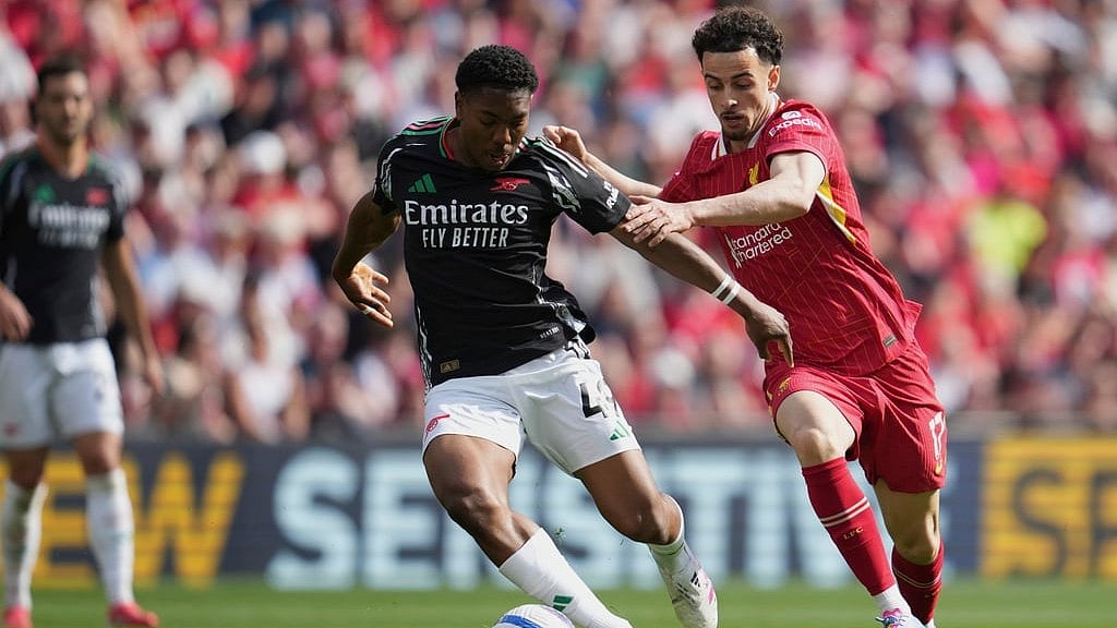 AP : Arsenal travel to Anfield to take on the PL champions Liverpool.