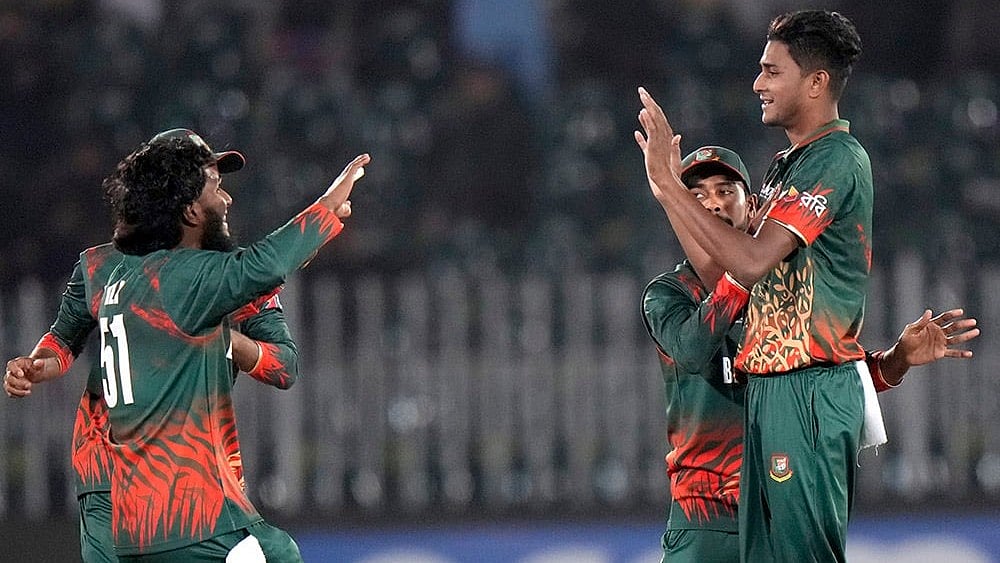 | Photo: AP/Anjum Naveed : ICC Champions Trophy, BAN vs NZ: Bangladesh's Nahid Rana celebrates Kane Williamson's wicket 