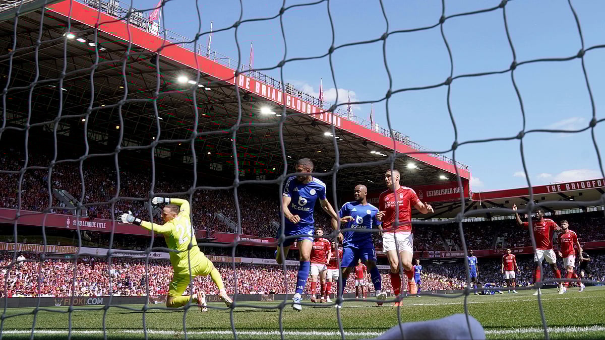 Nottingham Forests Morgan Gibbs-White, third right, rear, scores. AP