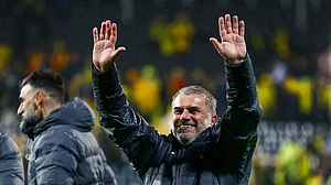 Ange Postecoglou celebrates after progressing to the Europa League final