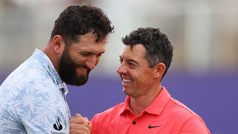 Jon Rahm and Rory McIlroy - null