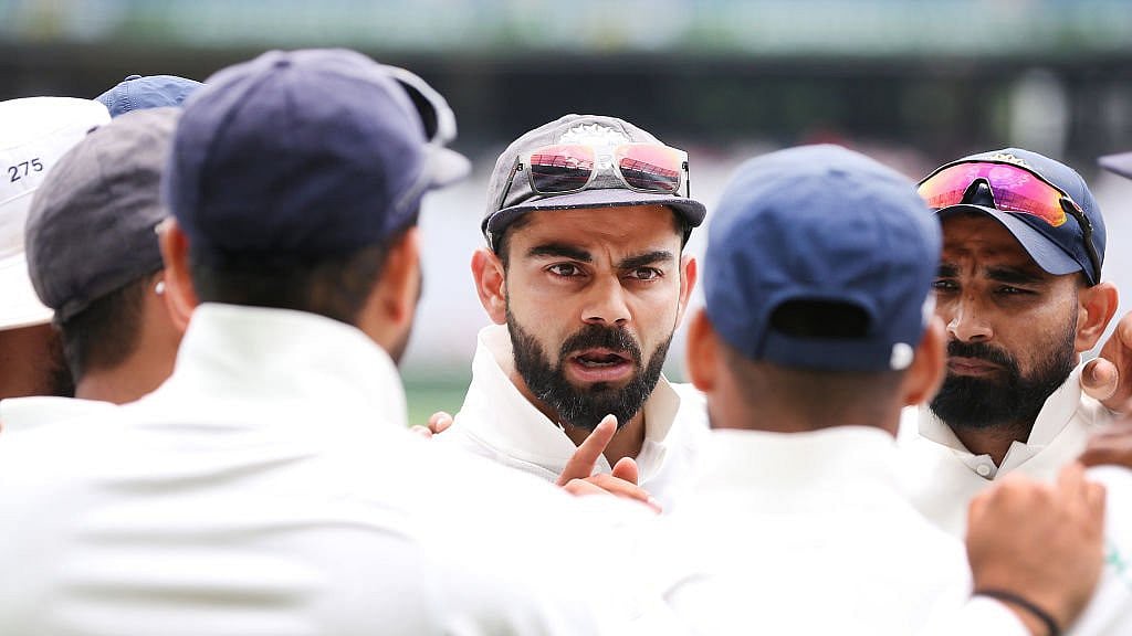 Virat Kohli talking to his teammates. - X/BCCI