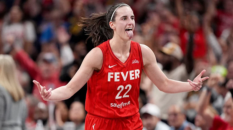 WNBA superstar Caitlin Clark of the Indiana Fever celebrates a basket.