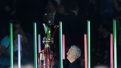 Italian football legend Roberto Baggio holds the trophy before the Coppa Italia final between AC Milan and Bologna at Rome's Olympic Stadium.