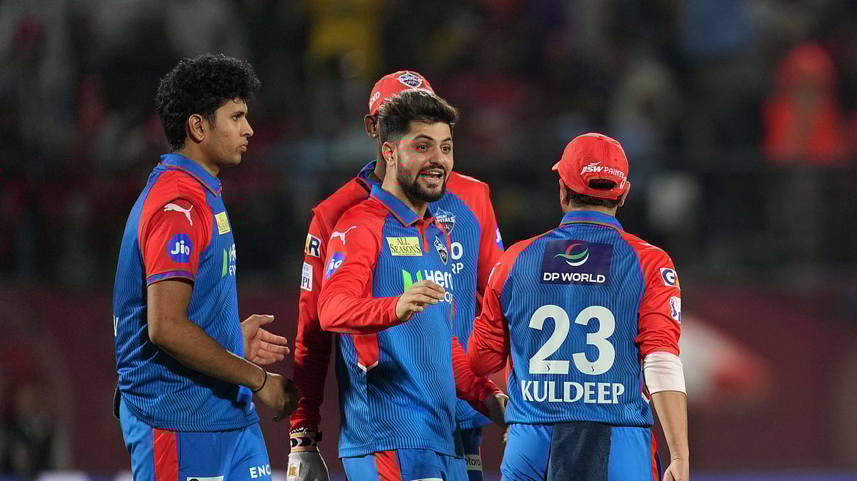 AP Photo/Ashwini Bhatia : Players of Delhi Capitals celebrate the dismissal of Punjab Kings' Priyansh Arya during the Indian Premier League cricket match between in Dharamsala.