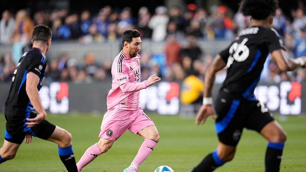 AP : Inter Miami midfielder Lionel Messi, center, moves the ball during the first half of an MLS soccer match against the San Jose Earthquakes.