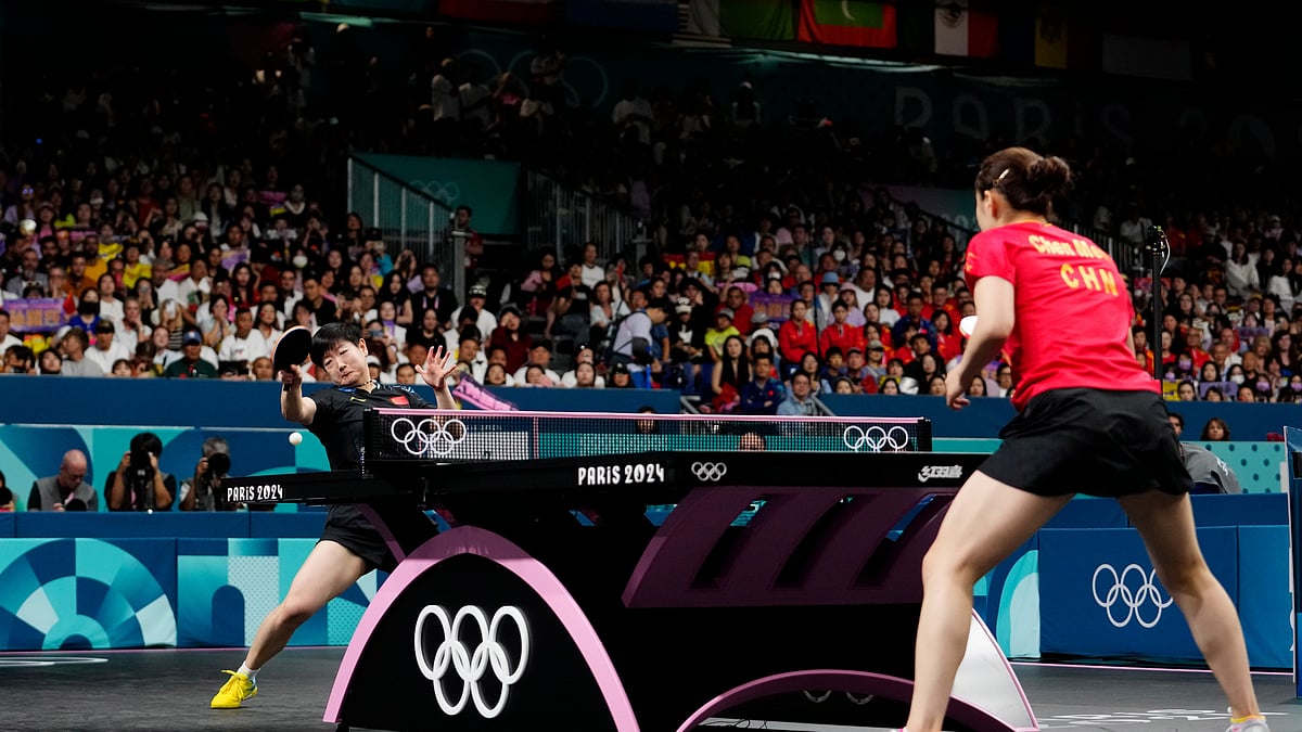 (AP Photo/Petros Giannakouris, file) : FILE - China's Sun Yingsha, background, plays against China's Chen Meng during the women's singles gold medal table tennis match at the 2024 Summer Olympics, Aug. 3, 2024, in Paris, France. 