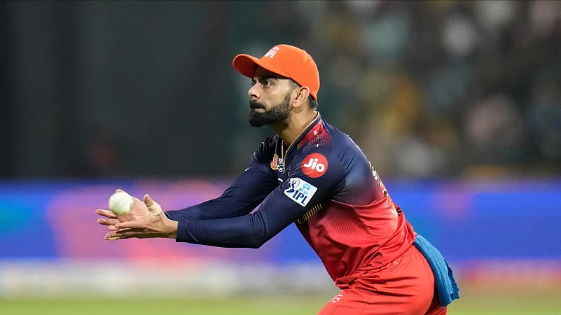 Royal Challengers Bengalurus Virat Kohli catches the ball. AP