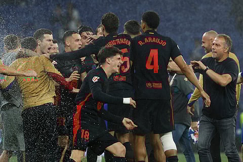 FC Barcelona players celebrate after beating Espanyol. Barca won the Spanish La Liga 2024-25 title.
