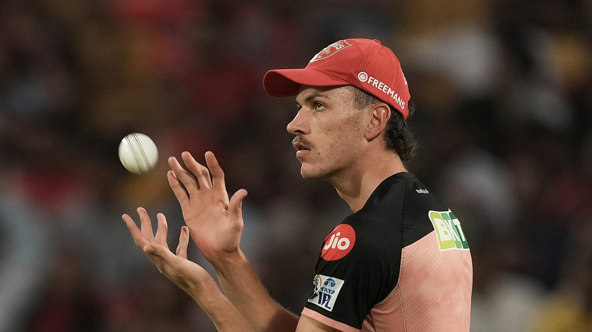 AP Photo/Ashwini Bhatia : Punjab Kings' Marco Jansen catches a ball before the Indian Premier League cricket match in Dharamshala.
