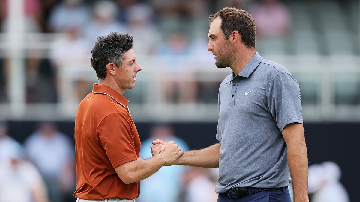 Rory McIlroy and Scottie Scheffler shake hands after their second rounds at Quail Hollow