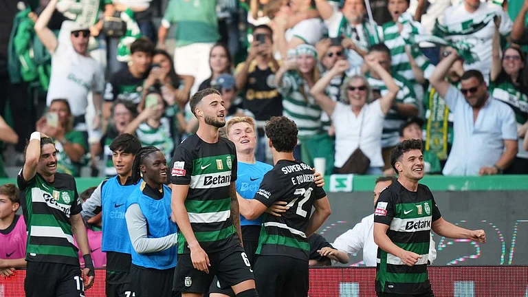 Sporting Lisbon's Pedro Goncalves, right, celebrates after scoring their opening goal during the Portuguese league last-round match against Vitoria SC. - Photo: AP