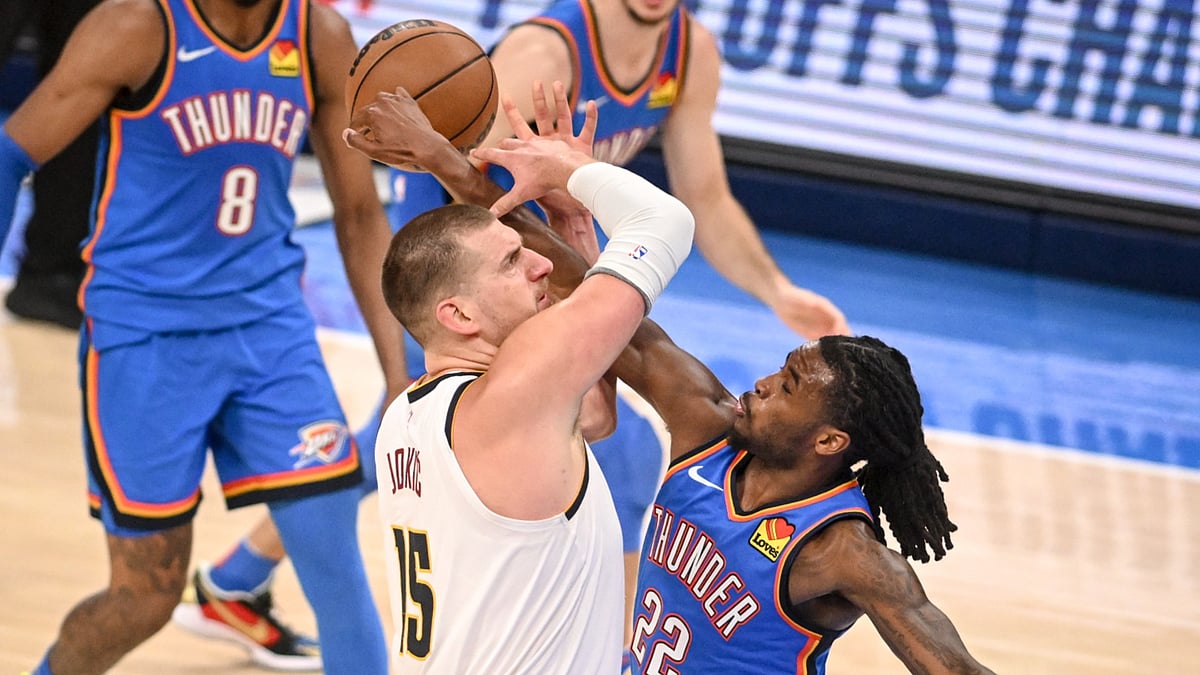 Oklahoma City Thunder guard Cason Wallace rejects Denver Nuggets center Nikola Jokic in Game 7 of a 2025 NBA Playoffs series.