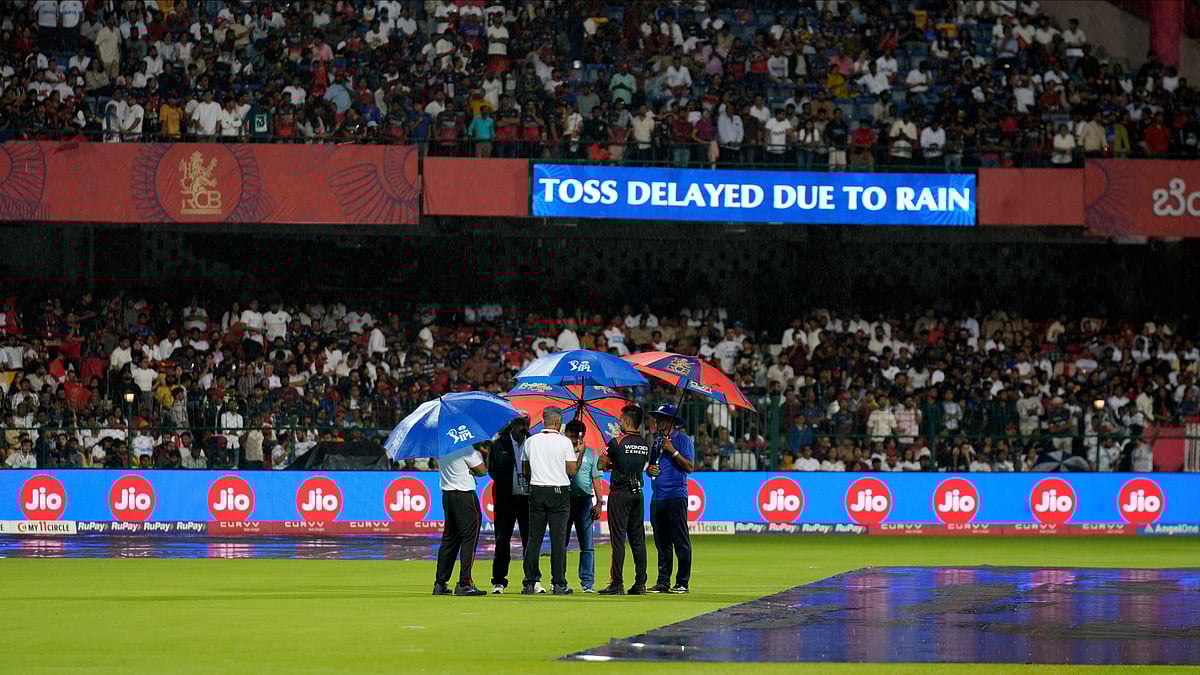 (AP Photo/Aijaz Rahi)
 : Match officials inspect the ground as the Indian Premier League cricket match between Kolkata Knight Riders and Royal Challengers Bengaluru gets delayed due to the rain at Chinnaswamy Stadium in Bengaluru, India, Saturday, May 17, 2025. 


