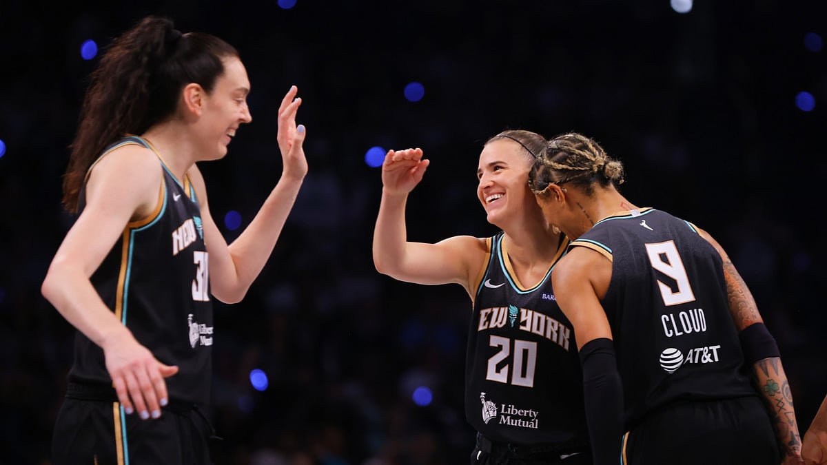 Sabrina Ionescu of the New York Liberty celebrates after making a basket with Natasha Cloud and Breanna Stewart against the Las Vegas Aces at Barclays Center on May 17, 2025 in New York City. New York Liberty defeated the Las Vegas Aces 92-78. - null