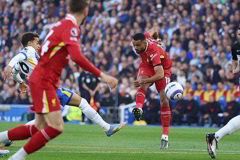 Liverpool's Cody Gakpo kicks the ball during the English Premier League soccer match between Brighton and Liverpool at American Express Stadium in Brighton, England, Monday, May 19, 2025. 
