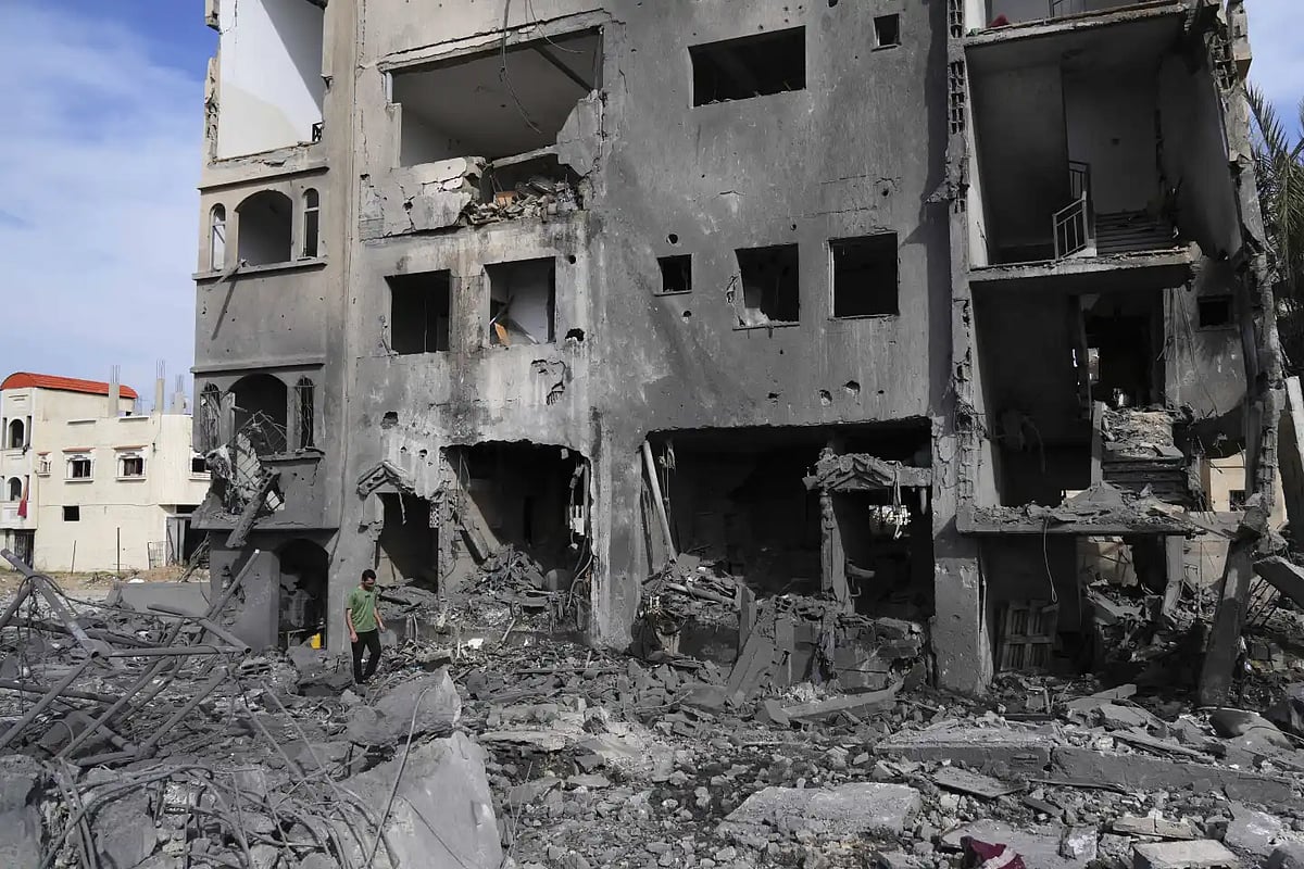 | AP/Abdel Kareem Hana : A Palestinian man walks on the rubble of the Al-Zainati family's home, destroyed by Israeli airstrikes in Khan Younis, Gaza Strip on Thursday, May 15, 2025.