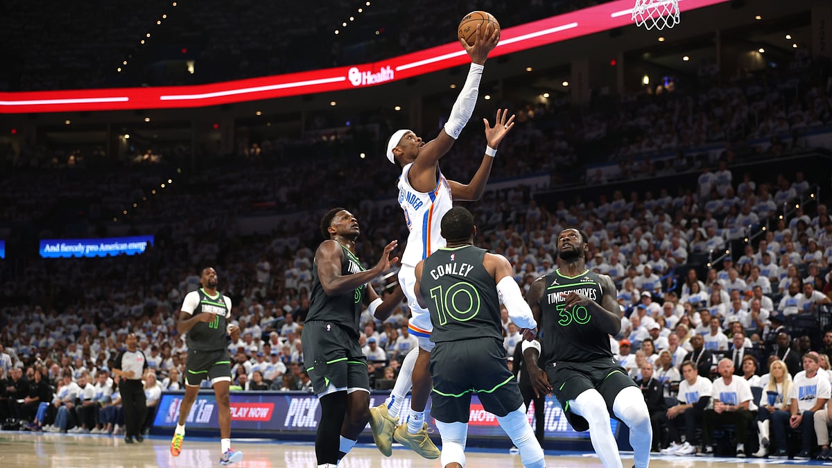 Shai Gilgeous-Alexander drives to the basket against the Minnesota Timberwolves - null