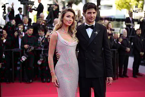 Cannes 2025, Day 8: Flavy Barl and Esteban Ocon during A Private Life premiere