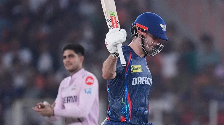 Mitchell Marsh raises his bat. - AP/Ajit Solanki