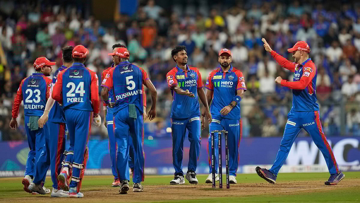 (AP Photo/Rajanish Kakade) : Delhi Capitals Mustafizur Rahman, third right, celebrates the dismissal of /Mumbai Indians' Rohit Sharma during the Indian Premier League cricket match between Mumbai Indians and Delhi Capitals at Wankhede Stadium in Mumbai, India, Wednesday, May 21, 2025. 
