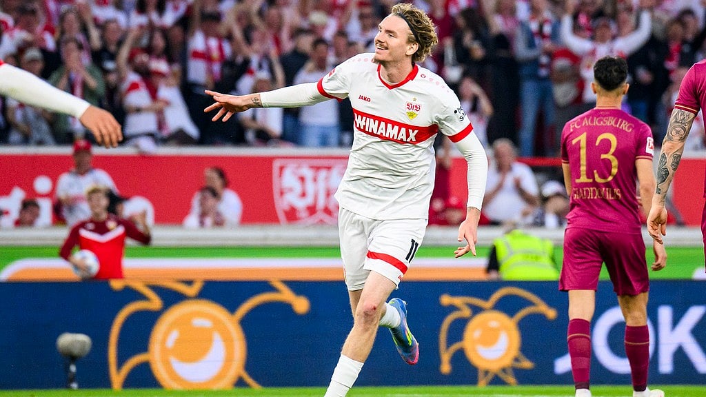 AP : Stuttgart's Nick Woltemade celebrates after scoring his side's second goal during their German Bundesliga match against FC Augsburg.